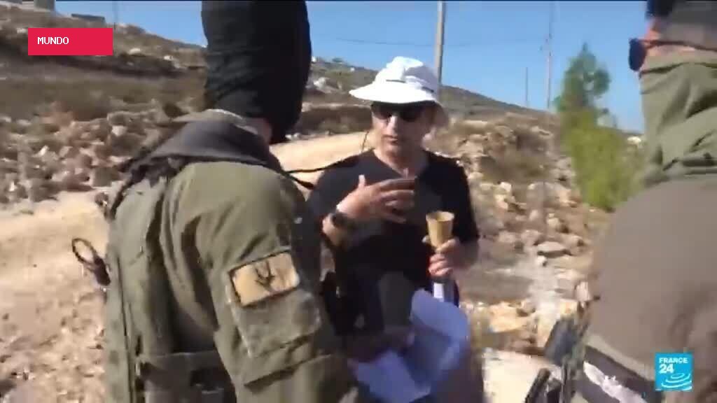 Palestinian American challenges Israeli army outside his home in the West Bank